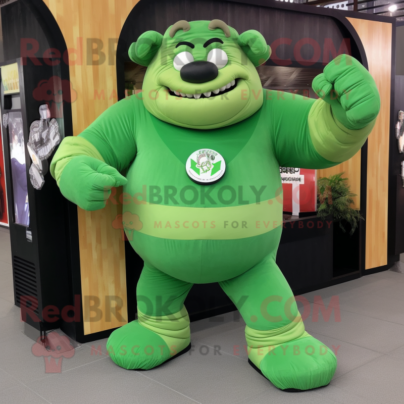 Green Strongman mascot costume character dressed with a Romper and Messenger bags Green Strongman mascot costume character dressed with a Romper and Messenger bags