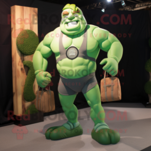 Green Strongman mascot costume character dressed with a Romper and Messenger bags