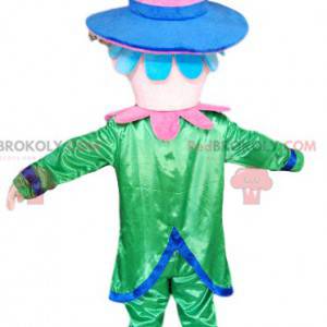 Mascote sorridente com um traje verde e um chapéu rosa -