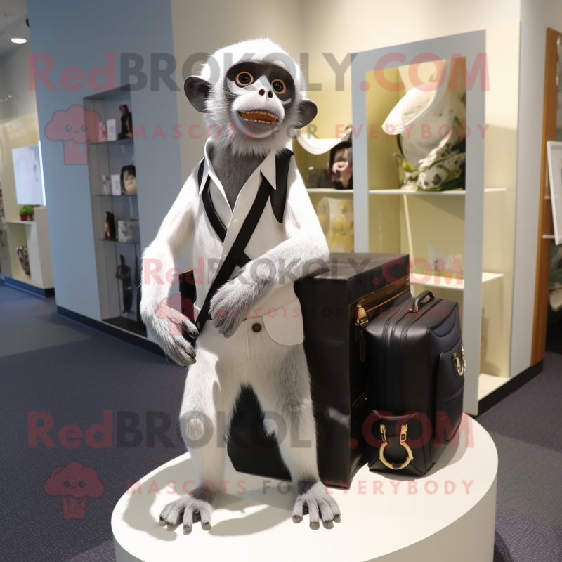 Silver Capuchin Monkey mascot costume character dressed with a Tuxedo and Messenger bags