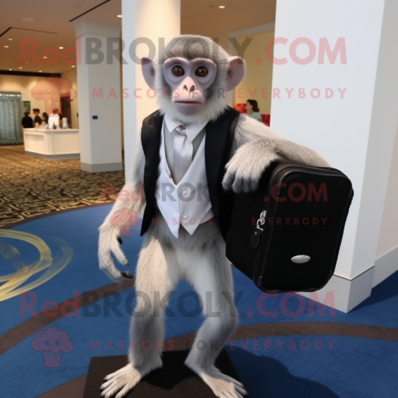 Silver Capuchin Monkey mascot costume character dressed with a Tuxedo and Messenger bags