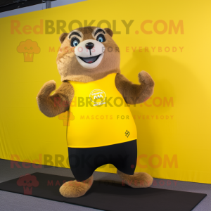 Yellow Marmot mascot costume character dressed with a Yoga Pants and Foot pads