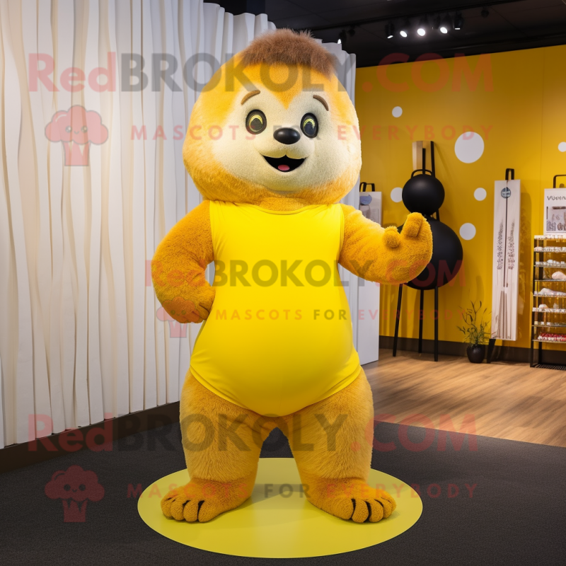 Yellow Marmot mascot costume character dressed with a Yoga Pants and Foot pads Yellow Marmot mascot costume character dressed with a Yoga Pants and Foot pads