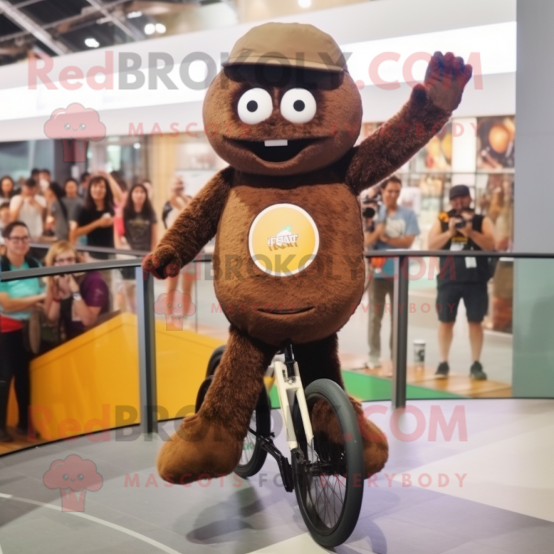 Brown Unicyclist mascot costume character dressed with a T-Shirt and Clutch bags Brown Unicyclist mascot costume character dressed with a T-Shirt and Clutch bags