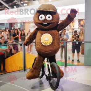 Brown Unicyclist mascot costume character dressed with a T-Shirt and Clutch bags