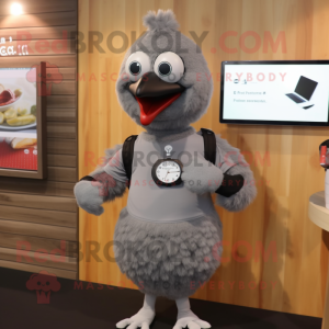 Gray Hens mascot costume character dressed with a T-Shirt and Smartwatches