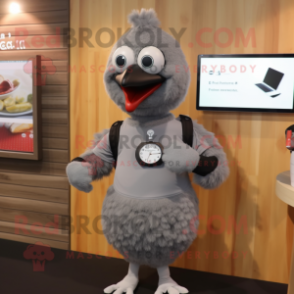 Gray Hens mascot costume character dressed with a T-Shirt and Smartwatches