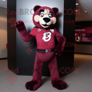 Maroon Panther mascot costume character dressed with a Graphic Tee and Suspenders