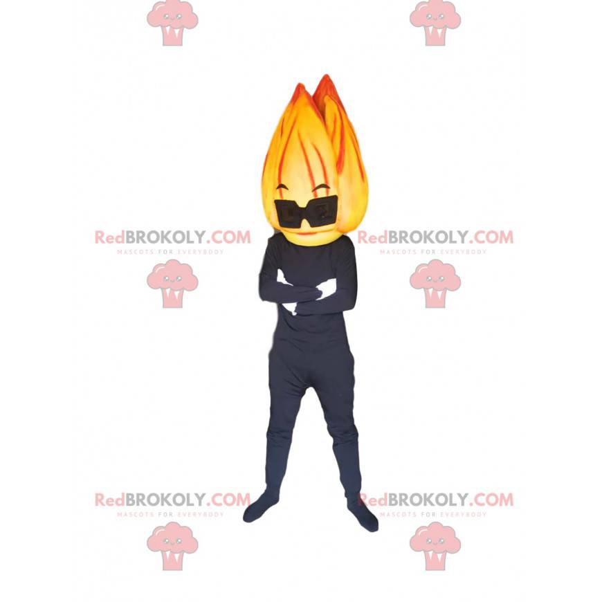 Black character mascot with a head in the form of a flame -