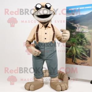 Tan Titanoboa mascot costume character dressed with a Overalls and Reading glasses