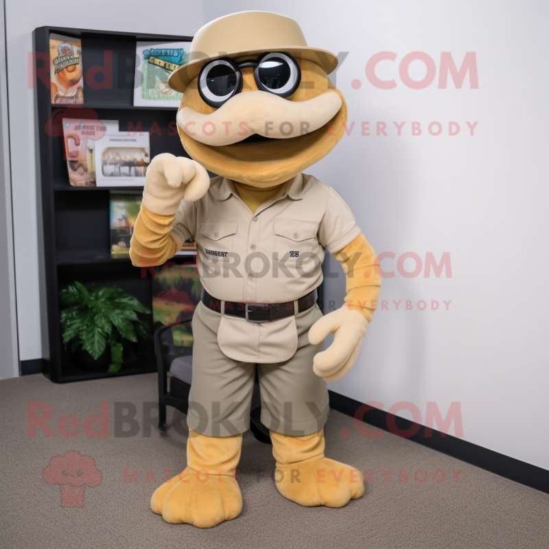 Tan Titanoboa mascot costume character dressed with a Overalls and Reading glasses