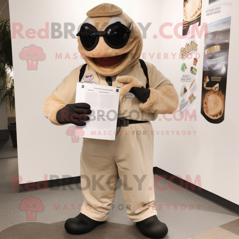Tan Titanoboa mascot costume character dressed with a Overalls and Reading glasses Tan Titanoboa mascot costume character dressed with a Overalls and Reading glasses
