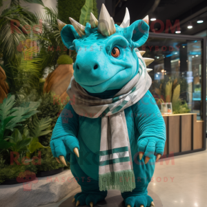 Turquoise Triceratops mascot costume character dressed with a Parka and Scarves
