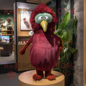 Maroon Kiwi mascot costume character dressed with a Blouse and Earrings