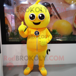 Lemon Yellow Pumpkin mascot costume character dressed with a Jumpsuit and Digital watches