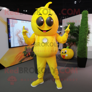 Lemon Yellow Pumpkin mascot costume character dressed with a Jumpsuit and Digital watches