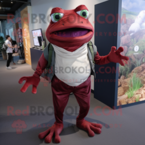 Maroon Frog mascot costume character dressed with a Chinos and Foot pads