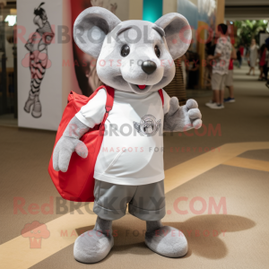 Silver Rat mascot costume character dressed with a Polo Shirt and Tote bags