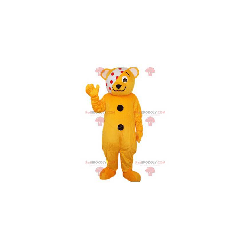 Mascota oso naranja naranja con una venda blanca con puntos