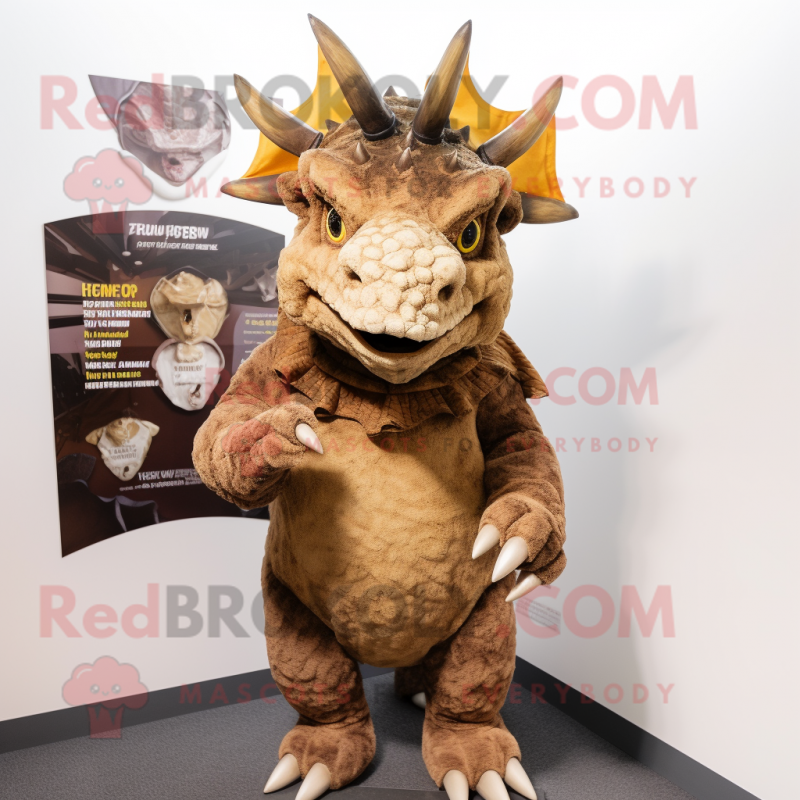 Brown Triceratops mascot costume character dressed with a T-Shirt and Shawl pins Brown Triceratops mascot costume character dressed with a T-Shirt and Shawl pins