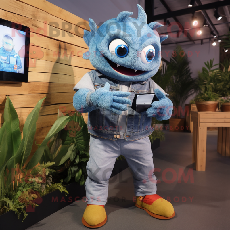 Blue Piranha mascot costume character dressed with a Denim Shirt and Smartwatches Blue Piranha mascot costume character dressed with a Denim Shirt and Smartwatches