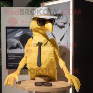 Gold Archeopteryx mascot costume character dressed with a Oxford Shirt and Sunglasses