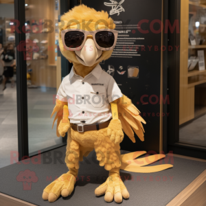 Gold Archeopteryx mascot costume character dressed with a Oxford Shirt and Sunglasses