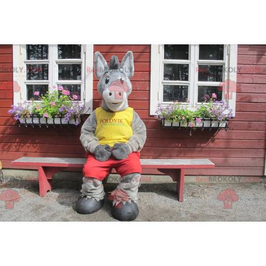 Gray donkey mascot in yellow and red outfit - Redbrokoly.com