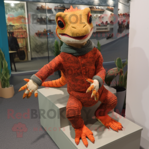 Rust Geckos mascot costume character dressed with a Sweater and Foot pads