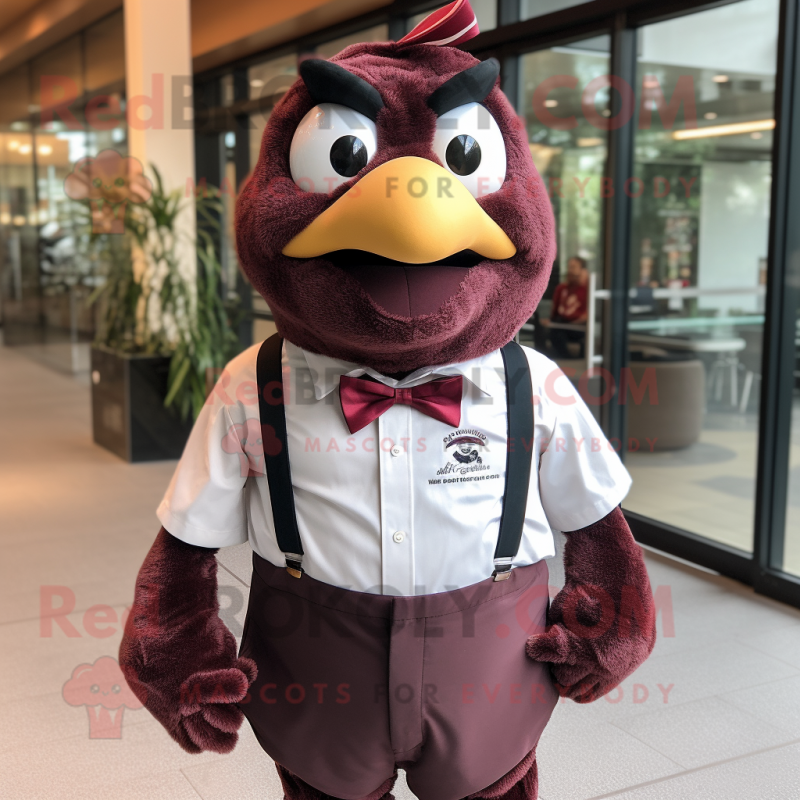 Maroon Quail mascot costume character dressed with a Graphic Tee and Bow ties