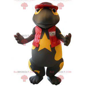 Mascot bastante salamandra negra y amarilla vestida de rojo -