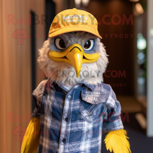 Yellow Haast'S Eagle mascot costume character dressed with a Chambray Shirt and Caps