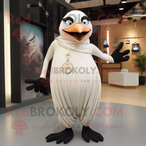 Cream Blackbird mascot costume character dressed with a Yoga Pants and Shawl pins