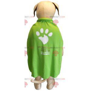 Beige en witte hond mascotte met een groene cape -