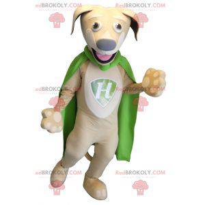 Beige and white dog mascot with a green cape - Redbrokoly.com