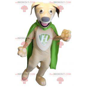 Beige en witte hond mascotte met een groene cape -