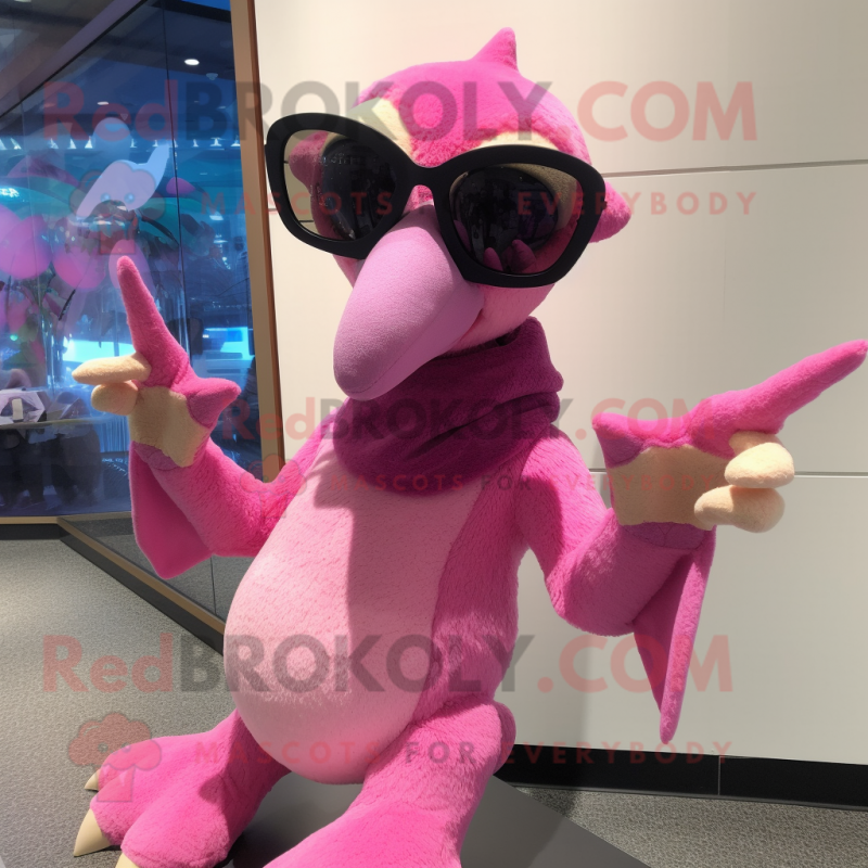 Pink Pterodactyl mascot costume character dressed with a Sweater and Sunglasses Pink Pterodactyl mascot costume character dressed with a Sweater and Sunglasses