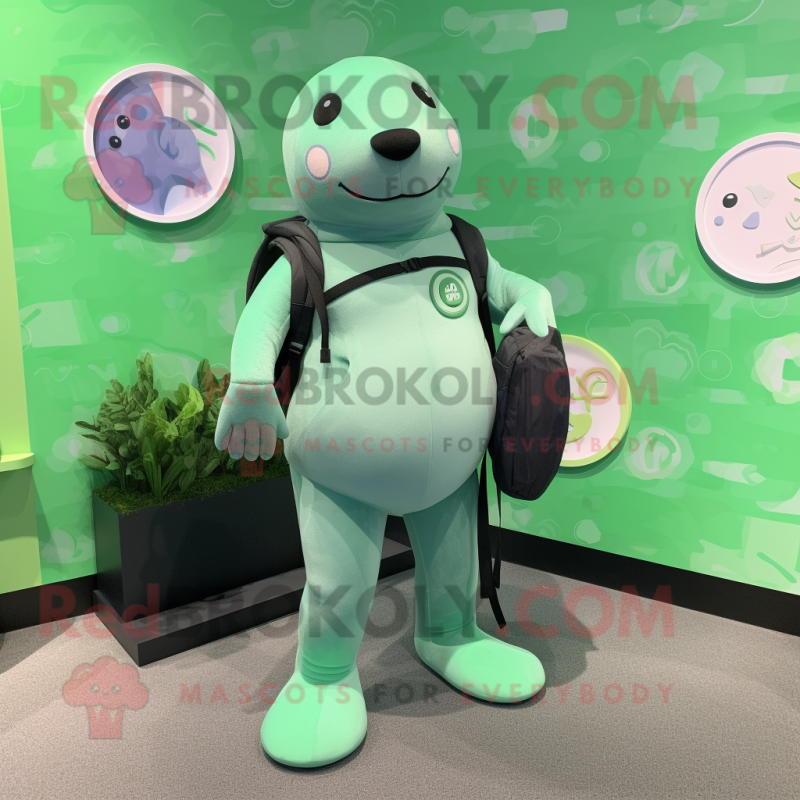 Green Seal mascot costume character dressed with a Yoga Pants and Backpacks