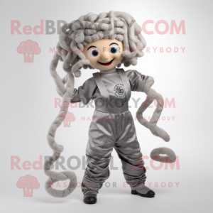 Silver Medusa mascot costume character dressed with a Overalls and Hairpins