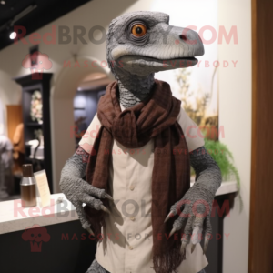 Gray Deinonychus mascot costume character dressed with a Polo Tee and Shawl pins
