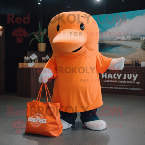 Orange Humpback Whale mascot costume character dressed with a Henley Tee and Tote bags