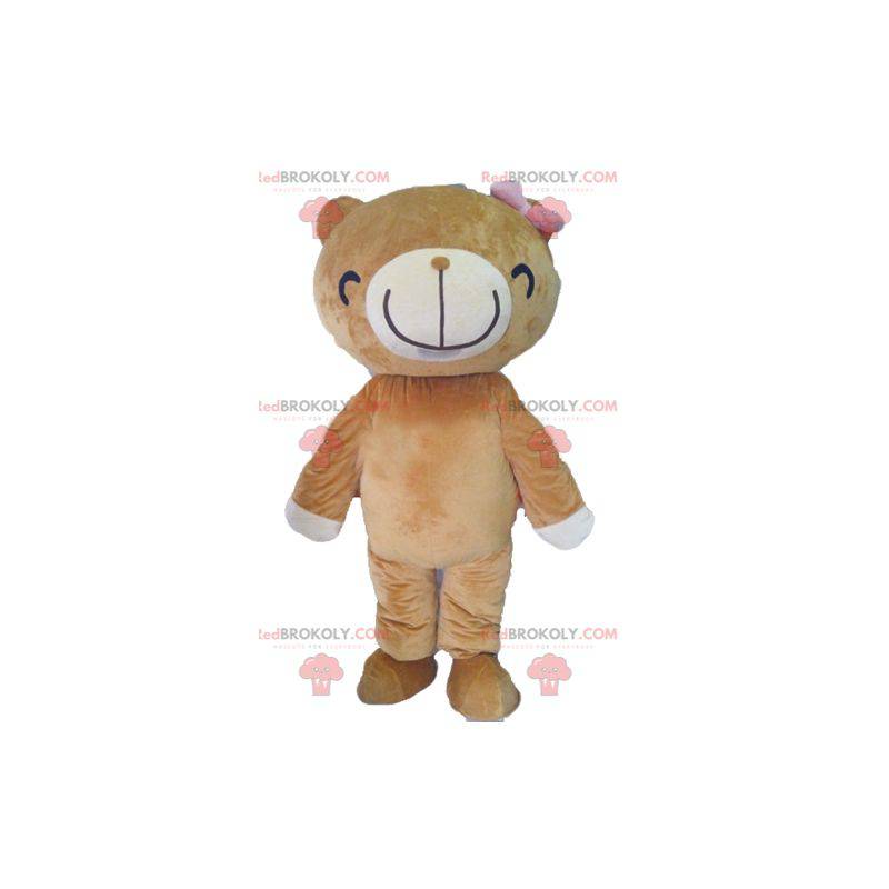 Beige mascotte e orso bianco con un ampio sorriso -