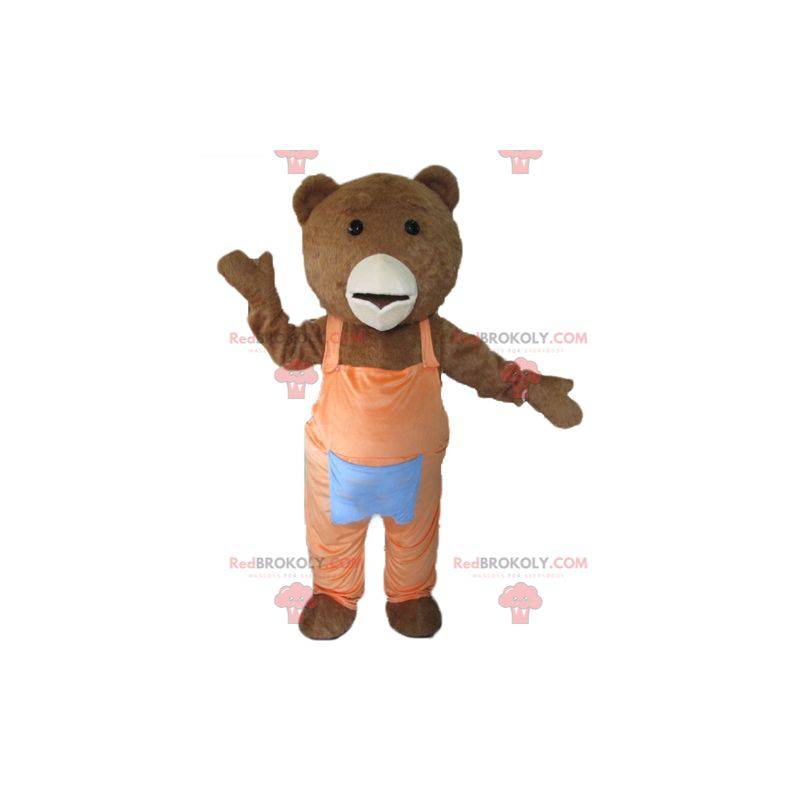 Mascotte d'ours marron et blanc avec une salopette orange -