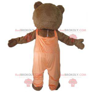 Brun och vit björnmaskot med orange overaller - Redbrokoly.com