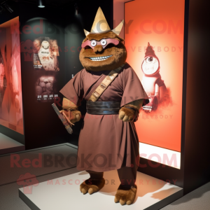 Brown Samurai mascot costume character dressed with a Empire Waist Dress and Tie pins