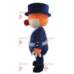 Mascotte d'ours orange et blanc en uniforme bleu -