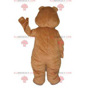 Mascote grande urso marrom e amarelo muito sorridente -