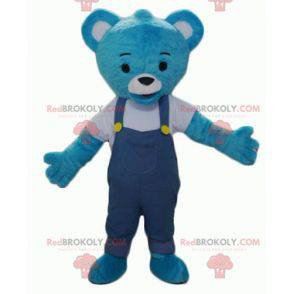 Mascotte de nounours en peluche bleu avec une salopette -