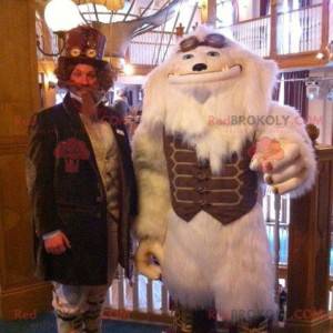 Mascot monstruo blanco yeti blanco con un traje marrón -