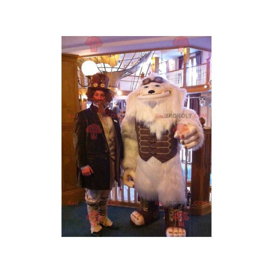 Mascot monstruo blanco yeti blanco con un traje marrón -